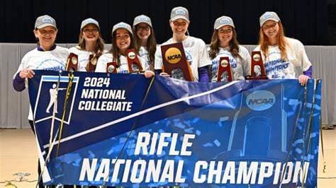 TCU hoisting the national championship poster